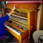 One of the pianos I worked on while in Africa. Note the piano bench.